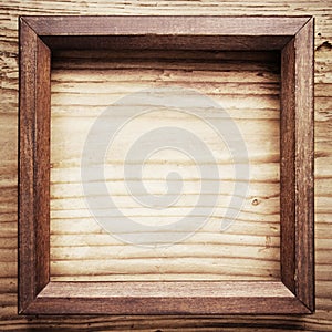 Wooden frame on wood background