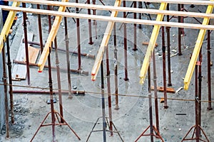 Wooden frames and metal reinforcement at new building construction site