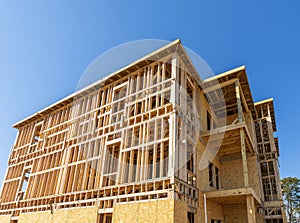 Wooden Framework Of New Apartment Building In Early Construction Phase