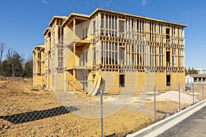 Wooden Framework Of New Apartment Building Under Construction