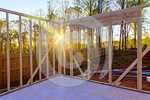 Wooden framing beams in an unfinished house construction work in progress view