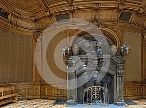 Wooden fretted lobby with fireplace of Scientists` House in Lviv, Ukraine