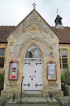 Wooden front door of old village hall