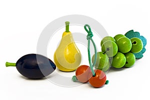 Wooden fruits plum, pear, cherry, grapes