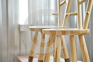 Wooden furniture. Creative child chairs made of natural wood in painting chamber