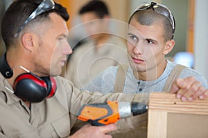 Wooden furniture and decor workers talking