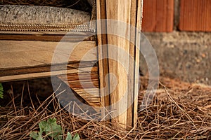 Wooden furniture made of natural materials in the garden. old wooden furniture in the vintage inlaid detai