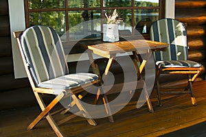 Wooden furniture table and chairs at sunset