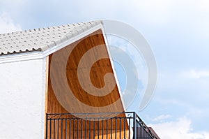 Wooden gabled roof with blue sky