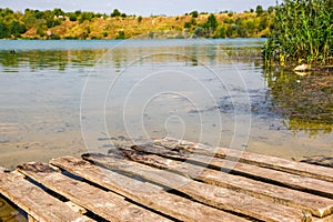 Wooden gangway on the lake