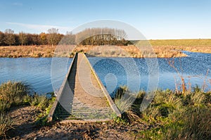 Wooden gangway over blue rippling water