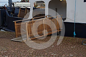 Wooden gangway with railing for boarding