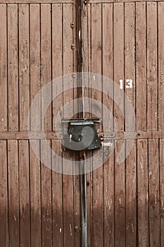 wooden garage door with lock. brown board