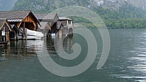 Wooden garages for boats and speedboats on the lake photo