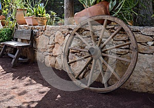 Wooden garden decors, bench and wheel