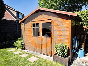 Wooden garden shed in a summer