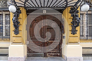 Wooden Gate entrance of Diescher house with decorative plate embossments on Akademia street in Budapest Hungary photo