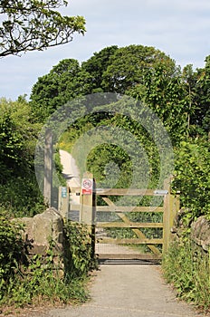 Wooden gate at entrance to concessionary footpath