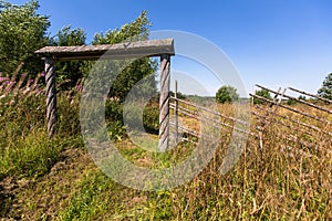 Wooden gate and field in the village. Nature.