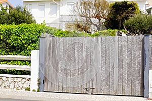 Wooden gate high closed of private house suburb wood portal home door