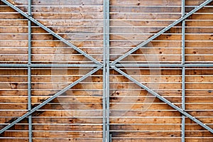 Wooden gate on metal frame covering locked area for tourists