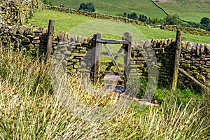 Wooden gate Peak District Dovestone Reservoir Greenfield, England, UK.