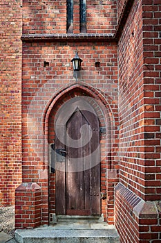 Wooden gates in a side entrance in an old church