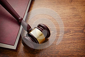 Wooden Gavel and Book on Wooden Table