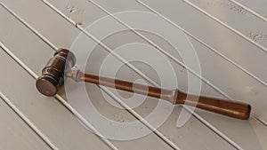 A wooden gavel on a clear background