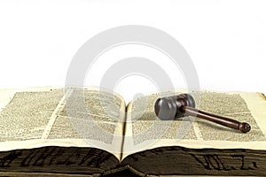 Wooden gavel and law book photo