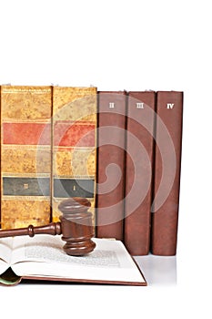 Wooden gavel and old law books