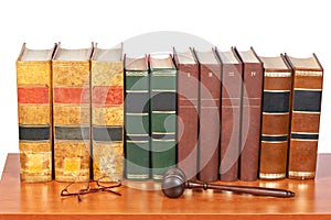 Wooden gavel and old law books