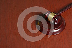 Wooden Gavel with stang on table background photo