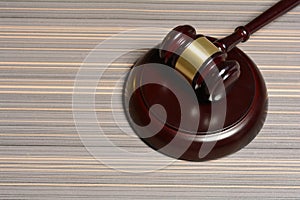 Wooden Gavel with stang on table background photo