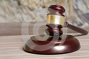 Wooden Gavel with stang on table background photo