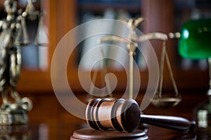 Wooden gavel on wooden table,legal books background