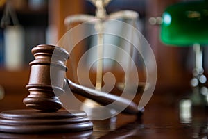 Wooden gavel on wooden table,legal books background