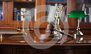 Wooden gavel on wooden table,legal books background