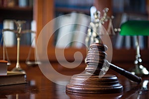 Wooden gavel on wooden table,legal books background