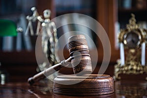 Wooden gavel on wooden table,legal books background