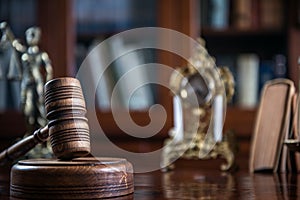 Wooden gavel on wooden table,legal books background