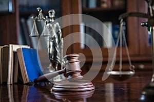 Wooden gavel on wooden table,legal books background