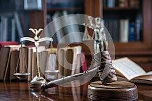 Wooden gavel on wooden table,legal books background