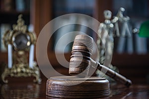 Wooden gavel on wooden table,legal books background