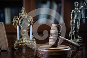 Wooden gavel on wooden table,legal books background