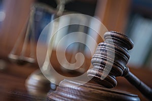 Wooden gavel on wooden table,legal books background