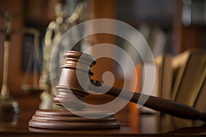 Wooden gavel on wooden table,legal books background