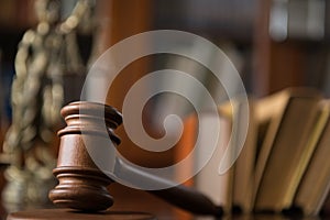 Wooden gavel on wooden table,legal books background