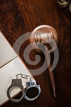 Wooden gavel on wooden table,legal books background