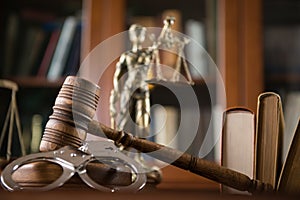 Wooden gavel on wooden table,legal books background